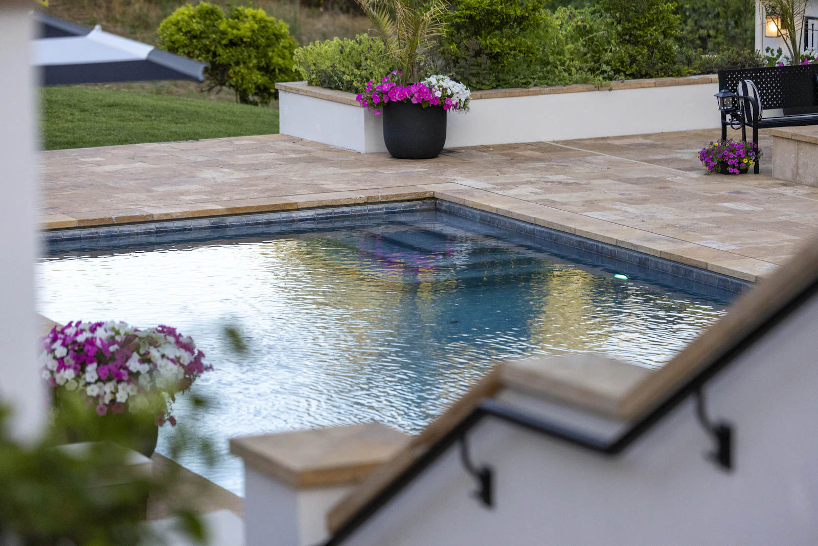 In-ground swimming pool in a family house garden